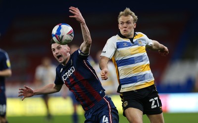 090321 Newport County v Bradford City, Sky Bet League 2 - Paudie O'Connor of Bradford City is challenged by Jake Scrimshaw of Newport County