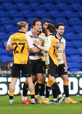090321 Newport County v Bradford City, Sky Bet League 2 - Matty Dolan of Newport County is congratulated by team mates after he scores the winning goal from the penalty spot with the final kick of the match