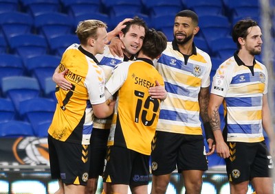 090321 Newport County v Bradford City, Sky Bet League 2 - Matty Dolan of Newport County is congratulated by team mates after he scores the winning goal from the penalty spot with the final kick of the match