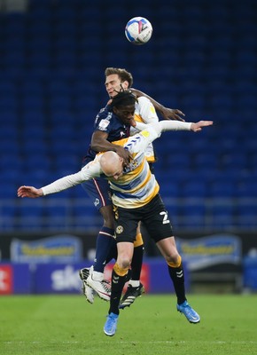090321 Newport County v Bradford City, Sky Bet League 2 - Clayton Donaldson of Bradford City is caught between Kevin Ellison of Newport County and Mickey Demetriou of Newport County as they battle for the ball
