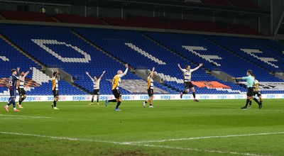 090321 Newport County v Bradford City, Sky Bet League 2 - Referee Will Finnie points to the penalty spot as Newport County players appeal for a penalty in the final minutes of the match