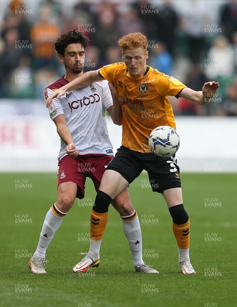 091021 - Newport County v Bradford City, Sky Bet League 2 - Ryan Haynes of Newport County holds off the challenge from Alex Gilliead of Bradford City