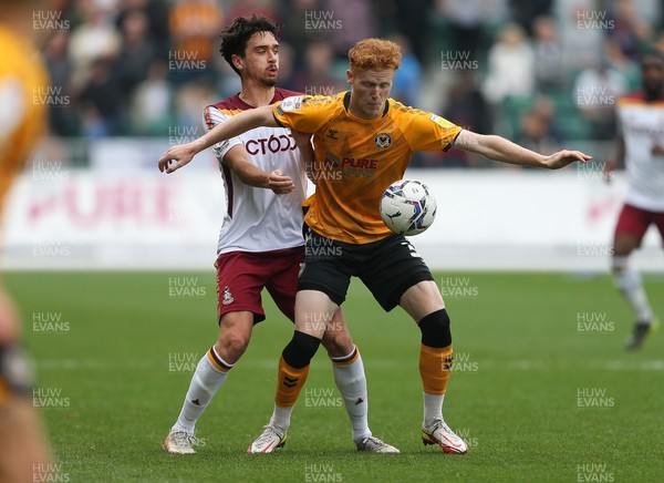 091021 - Newport County v Bradford City, Sky Bet League 2 - Ryan Haynes of Newport County holds off the challenge from Alex Gilliead of Bradford City