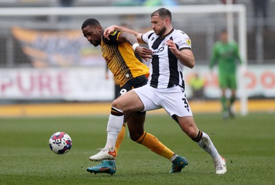 110323 - Newport County v Bradford City - SkyBet League Two - Omar Bogle of Newport County is challenged by Liam Ridehalgh of Bradford City