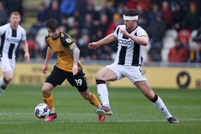 110323 - Newport County v Bradford City - SkyBet League Two - Charlie McNeill of Newport County is challenged by Matthew Platt of Bradford City