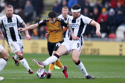 110323 - Newport County v Bradford City - SkyBet League Two - Charlie McNeill of Newport County is challenged by Matthew Platt of Bradford City