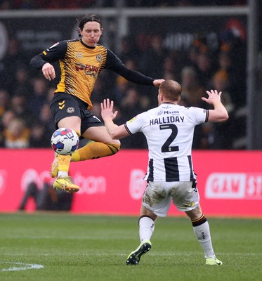 110323 - Newport County v Bradford City - SkyBet League Two - Aaron Lewis of Newport County is challenged by Brad Halliday of Bradford City