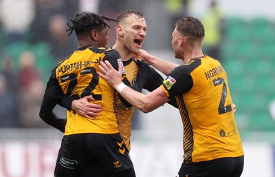 110323 - Newport County v Bradford City - SkyBet League Two - Mickey Demetriou of Newport County celebrates with team mates after scoring a goal