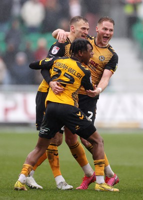 110323 - Newport County v Bradford City - SkyBet League Two - Mickey Demetriou of Newport County celebrates with team mates after scoring a goal