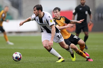 110323 - Newport County v Bradford City - SkyBet League Two - Sam Stubbs of Bradford City is challenged by Charlie McNeill of Newport County 