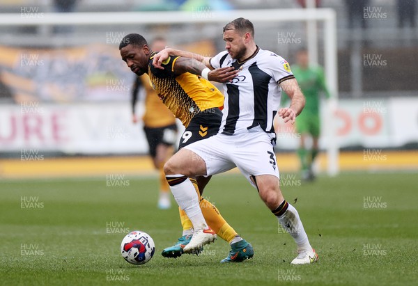 110323 - Newport County v Bradford City - SkyBet League Two - Omar Bogle of Newport County is challenged by Liam Ridehalgh of Bradford City