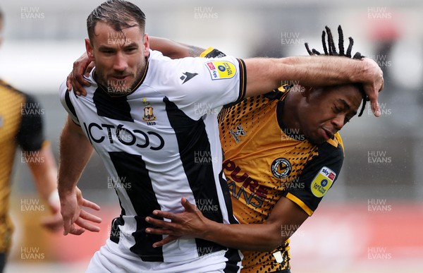 110323 - Newport County v Bradford City - SkyBet League Two - Liam Ridehalgh of Bradford City is challenged by Nathan Moriah-Welsh of Newport County
