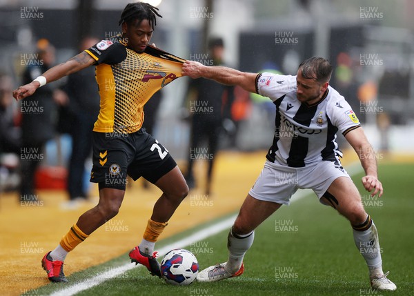 110323 - Newport County v Bradford City - SkyBet League Two - Nathan Moriah-Welsh of Newport County is tackled by Liam Ridehalgh of Bradford City