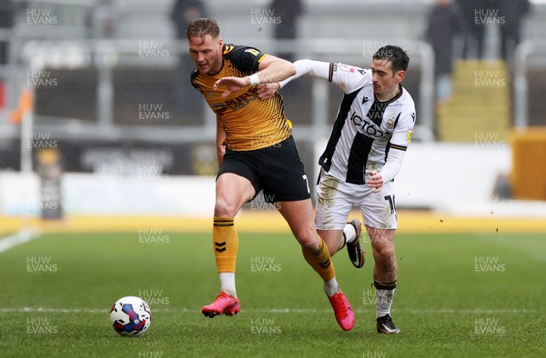 110323 - Newport County v Bradford City - SkyBet League Two - Cameron Norman of Newport County is challenged by Jamie Walker of Bradford City 