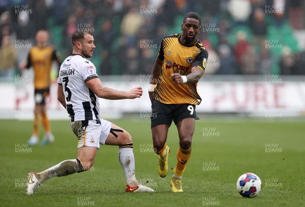 110323 - Newport County v Bradford City - SkyBet League Two - Omar Bogle of Newport County is challenged by Liam Ridehalgh of Bradford City 