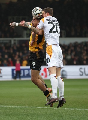 150225  Newport County v Bradford City, EFL Sky Bet League 2 - Courtney Baker-Richardson of Newport County looks to head at goal as Paul Huntington of Bradford City challenges