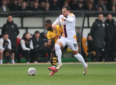 150225  Newport County v Bradford City, EFL Sky Bet League 2 - David Ajiboye of Newport County is challenged by Antoni Sarcevic of Bradford City