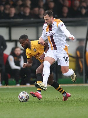 150225  Newport County v Bradford City, EFL Sky Bet League 2 - David Ajiboye of Newport County is challenged by Antoni Sarcevic of Bradford City