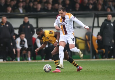 150225  Newport County v Bradford City, EFL Sky Bet League 2 - David Ajiboye of Newport County is challenged by Antoni Sarcevic of Bradford City