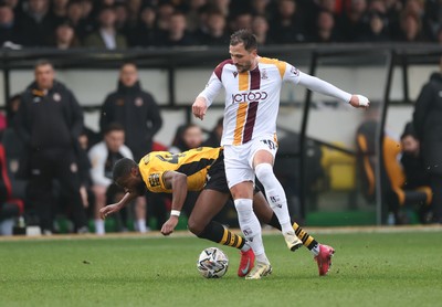 150225  Newport County v Bradford City, EFL Sky Bet League 2 - David Ajiboye of Newport County is challenged by Antoni Sarcevic of Bradford City