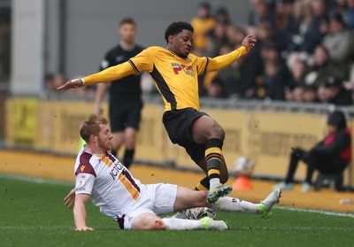 150225  Newport County v Bradford City, EFL Sky Bet League 2 - Bobby Kamwa of Newport County is tackled by Brad Halliday of Bradford City