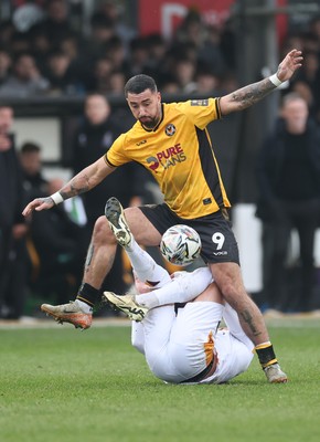 150225  Newport County v Bradford City, EFL Sky Bet League 2 - Courtney Baker-Richardson of Newport County and Antoni Sarcevic of Bradford City tangle as they compete for the ball