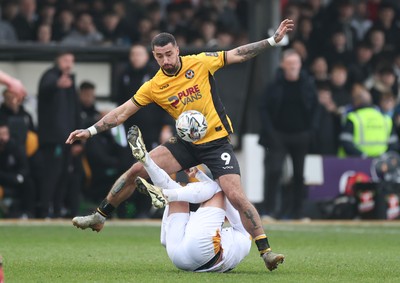 150225  Newport County v Bradford City, EFL Sky Bet League 2 - Courtney Baker-Richardson of Newport County and Antoni Sarcevic of Bradford City tangle as they compete for the ball