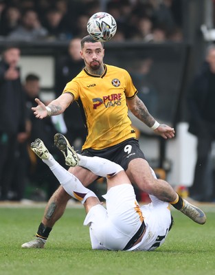 150225  Newport County v Bradford City, EFL Sky Bet League 2 - Courtney Baker-Richardson of Newport County and Antoni Sarcevic of Bradford City tangle as they compete for the ball