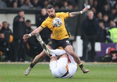 150225  Newport County v Bradford City, EFL Sky Bet League 2 - Courtney Baker-Richardson of Newport County and Antoni Sarcevic of Bradford City tangle as they compete for the ball