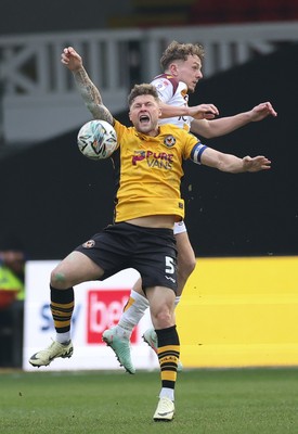 150225  Newport County v Bradford City, EFL Sky Bet League 2 - James Clarke of Newport County and Michael Mellon of Bradford City compete for the ball