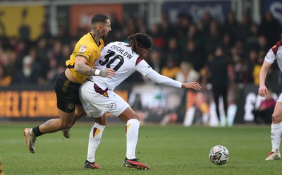 150225  Newport County v Bradford City, EFL Sky Bet League 2 - Courtney Baker-Richardson of Newport County takes on Romoney Crichlow-Noble of Bradford City