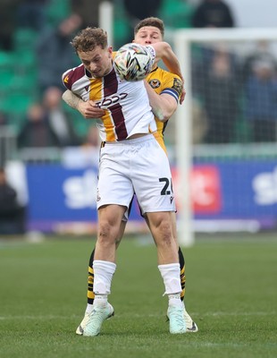 150225  Newport County v Bradford City, EFL Sky Bet League 2 - Michael Mellon of Bradford City and James Clarke of Newport County tangle as they compete for the ball