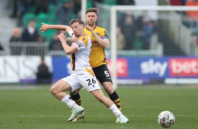 150225  Newport County v Bradford City, EFL Sky Bet League 2 - Michael Mellon of Bradford City and James Clarke of Newport County tangle as they compete for the ball