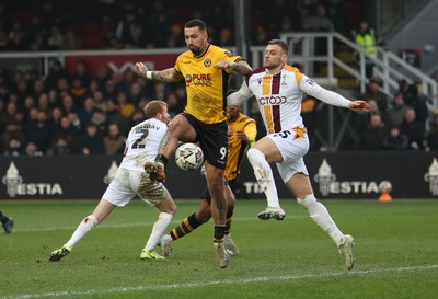 150225  Newport County v Bradford City, EFL Sky Bet League 2 - Courtney Baker-Richardson of Newport County is challenged by Aden Baldwin of Bradford City as he looks to shoot