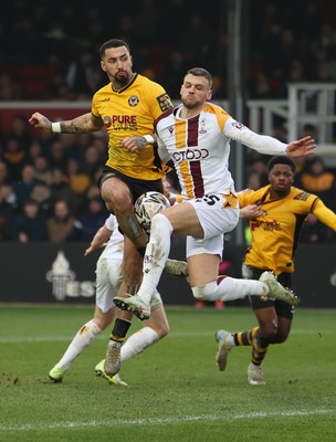 150225  Newport County v Bradford City, EFL Sky Bet League 2 - Courtney Baker-Richardson of Newport County is challenged by Aden Baldwin of Bradford City as he looks to shoot