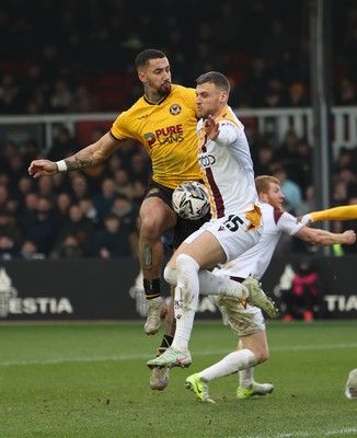 150225  Newport County v Bradford City, EFL Sky Bet League 2 - Courtney Baker-Richardson of Newport County is challenged by Aden Baldwin of Bradford City as he looks to shoot