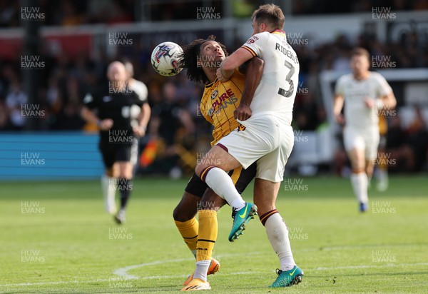 230923 - Newport County v Bradford City, EFL Sky Bet League 2 - Olly Thomas of Newport County and Liam Ridehalgh of Bradford City compete for the ball