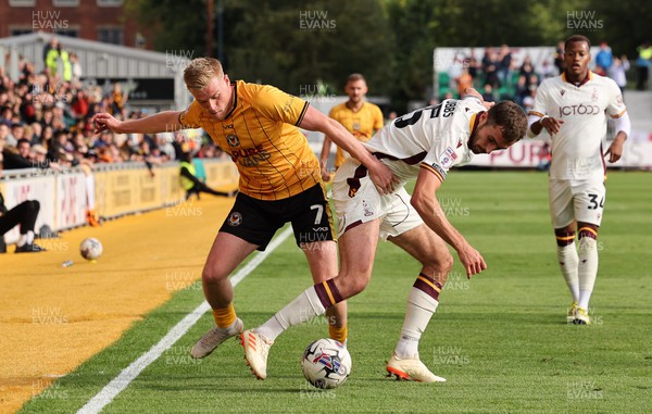 230923 - Newport County v Bradford City, EFL Sky Bet League 2 - Will Evans of Newport County and Sam Stubbs of Bradford City compete for the ball