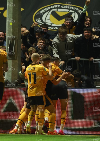 290823 - Newport County v Brentford, EFL Carabao Cup - Kiban Rai of Newport County is mobbed by supporters after he score goal