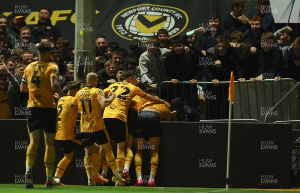 290823 - Newport County v Brentford, EFL Carabao Cup - Kiban Rai of Newport County is mobbed by supporters after he score goal