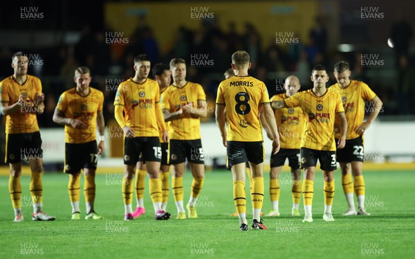 290823 - Newport County v Brentford, EFL Carabao Cup - Bryn Morris of Newport County walks back to his team mates after seeing his penalty saved by Ellery Balcombe of Brentford
