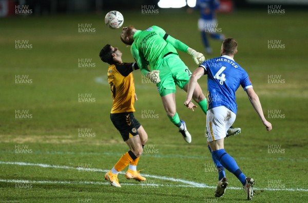 100121 - Newport County v Brighton and Hove Albion, FA Cup Third Round - Brighton goalkeeper Jason Steele tries to head the ball clear as Padraig Amond of Newport County challenges