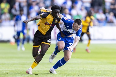 060925 - Newport County v Bristol Rovers - Sky Bet League 2 - Nathaniel Opoku of Newport County in action against Kacper Łopata of Bristol Rovers