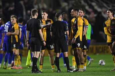 170326 - Newport County v Bromley - Sky Bet League 2 - Newport players surround the officials at full time to appeal a penalty decision