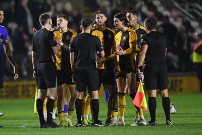 170326 - Newport County v Bromley - Sky Bet League 2 - Newport players surround the officials at full time to appeal a penalty decision