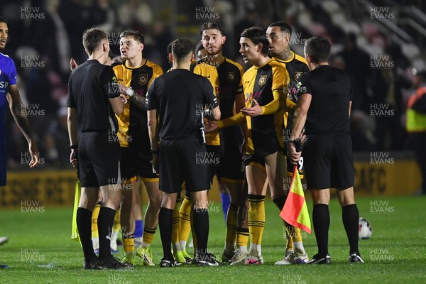 170326 - Newport County v Bromley - Sky Bet League 2 - Newport players surround the officials at full time to appeal a penalty decision