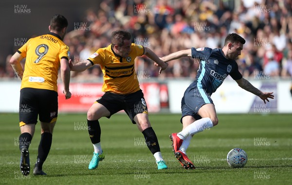190419 - Newport County v Bury FC - SkyBet League Two - Jay O'Shea of Bury is tackled by Matthew Dolan of Newport County