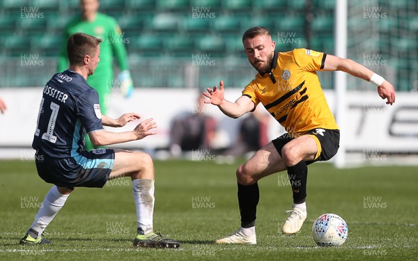 190419 - Newport County v Bury FC - SkyBet League Two - Dan Butler of Newport County is challenged by Jordan Rossiter of Bury