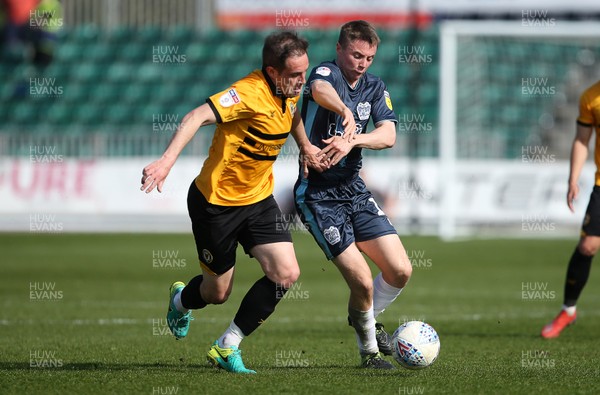 190419 - Newport County v Bury FC - SkyBet League Two - Matthew Dolan of Newport County is tackled by Jordan Rossiter of Bury