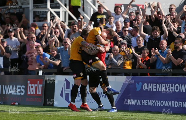190419 - Newport County v Bury FC - SkyBet League Two - Mickey Demetriou of Newport County celebrates scoring a goal with David Pipe and team mates